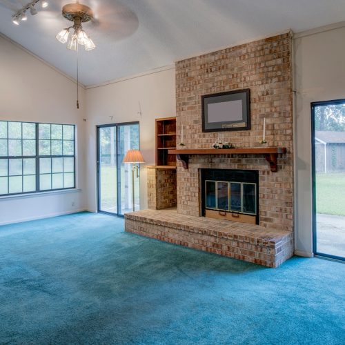 Simple living room in need of remodel.